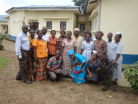 AIDS Healthcare Foundation (AHF) Medical Officer Dr. Sheik Humarr Khan (ON FAR LEFT, White Shirt & Khakis), who died at 39 of Ebola Virus Disease (EVD) July 29, 2014 in Sierra Leone, pictured in a group photo with AHF and Sierra Leone Ministry of Health staff during the group's first HIV/AIDS antiretroviral treatment (ART) training for staff and partners in Kenema. The picture, taken by the hall were the training was conducted, was taken on June 20, 2014 during the training, which took place from June 16 to 22, 2014 at the Kenema Government Hospital in the Eastern Province of Sierra Leone. (Photo: Business Wire)
