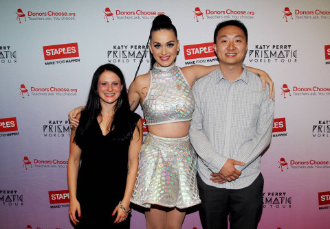 Global pop star Katy Perry, center, with local teachers, left to right, Amanda Robb and Yu Chen backstage at the TD Garden during her Prismatic World Tour performance on Fri., Aug 1 in Boston, Mass. Staples teamed up with superstar Katy Perry to "Make Roar Happen" and support teachers during the back-to-school season by donating $1 million to DonorsChoose.org, a charity that has helped fund more than 450,000 classroom projects for teachers and impacted more than 11 million students. (Photo by Marc Andrew Deley/Invision for Staples/AP Images)