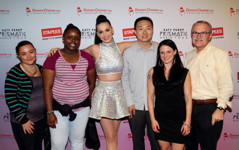 Global pop star Katy Perry, center, with local teachers, students and CEO and Chairman, Staples, left to right, Tajia Reverdes, Janile Campbell, Yu Chen, Amanda Robb and Ronald Sargent backstage at the TD Garden during her Prismatic World Tour performance on Fri., Aug 1 in Boston, Mass. Staples teamed up with superstar Katy Perry to "Make Roar Happen" and support teachers during the back-to-school season by donating $1 million to DonorsChoose.org, a charity that has helped fund more than 450,000 classroom projects for teachers and impacted more than 11 million students. (Photo by Marc Andrew Deley/Invision for Staples/AP Images)