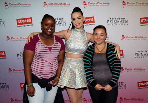 Global pop star Katy Perry, center, with local students, left to right, Janile Campbell and Tajia Reverdes backstage at the TD Garden during her Prismatic World Tour performance on Fri., Aug 1 in Boston, Mass. Staples teamed up with superstar Katy Perry to "Make Roar Happen" and support teachers during the back-to-school season by donating $1 million to DonorsChoose.org, a charity that has helped fund more than 450,000 classroom projects for teachers and impacted more than 11 million students. (Photo by Marc Andrew Deley/Invision for Staples/AP Images)