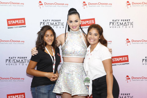Global pop star Katy Perry, center, with local students, left to right, Jocelyn Santiago and Mia Vega backstage at the Wells Fargo Center during her Prismatic World Tour performance on Tuesday, August 5, 2014 in Philadelphia. Staples teamed up with superstar Katy Perry to "Make Roar Happen" and celebrate and support teachers during the back-to-school season by donating $1 million to DonorsChoose.org, a charity that has helped fund more than 450,000 classroom projects for teachers and impacted more than 11 million students. (Photo by Mark Stehle/Invision for Staples/AP Images)