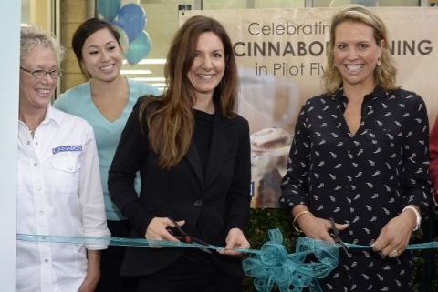 Cinnabon President Kat Cole and Whitney Johnson, director of brand and customer experience at Pilot Flying J, celebrate Cinnabon's 100th opening with the travel plaza chain in Mebane, North Carolina. (Photo: Business Wire)