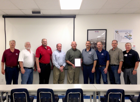 Pictured from Left to Right: Ron Valentine (QC Manager), Gary Foy (Materials Manager), Dennis Wilson (EHS Manager), Todd Smith (Plant Manager), Steve Smith (retired Plant Manager), Jay Bills (Superintendent), Mike Egbert (Plant Engineer), Joe Maylin (HR Manager), and Robert Gardner (Liberty Mutual)(Photo: Business Wire)