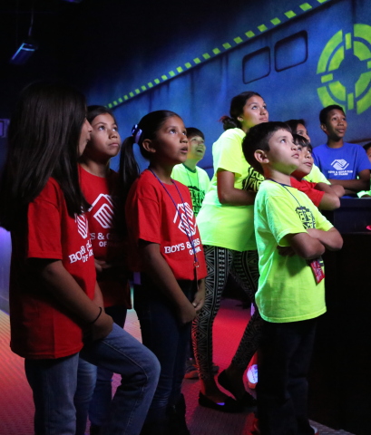 Photo courtesy of PharrNOW. To celebrate its first location in The Rio Grande Valley, Main Event Entertainment provided a sneak preview of its new center and a charitable gift of $5,000 to the Boys & Girls Club of Pharr on August 5. (Shown left to right) Isabella Sanchez, Alejandra Navarro, Alondra Navarro, Marcus Zamora, Joshua Olivarez, Bertha Cantu, Donovan De La Garza (behind Bertha), Alyssa Luna and Robert Mata all watch a video to prepare for their first game in the center's two-story laser tag court. (Photo: Business Wire)