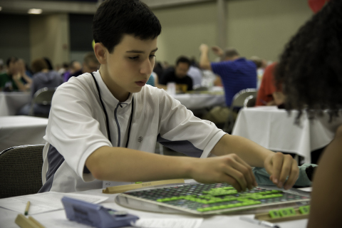 Mack Meller from Bedford, NY plays a word during the 2014 National SCRABBLE Championship at the Buffalo Niagara Convention Center, Wednesday August 13. At 14, Meller was the youngest competitor in the tournament’s Division 1 and finished in 7th place. (Photo: Business Wire)