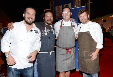 Chefs Fabio Viviani, left, Ray Garcia, Graham Elliot and Ben Ford participate in the Chase Sapphire Preferred Chef Challenge during the Ultimate Bites of L.A. at the Los Angeles Food & Wine Festival, presented by FOOD & WINE, on Thursday, Aug. 21, 2014 in Los Angeles. (Photo by Evan Agostini/Invision for Chase Sapphire Preferred/AP Images)