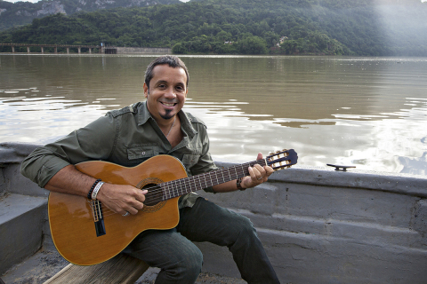Millo Torres during the filming of Popular’s music special “Qué lindo es Puerto Rico” in the Lago Dos Bocas in Utuado. (Photo: Business Wire)