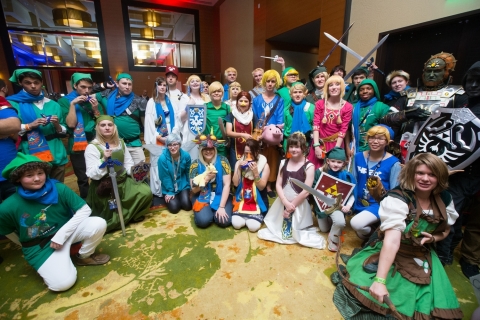 In this photo provided by Nintendo of America, fans dressed in costume pose for a photograph, while waiting in anticipation to play the action-packed Wii U game Hyrule Warriors before its Sept. 26 launch as part of an off-site event during PAX Prime 2014 on Aug. 30, 2014 in Seattle. (Photo by STEPHEN BRASHEAR/Invision for Nintendo/AP Images)