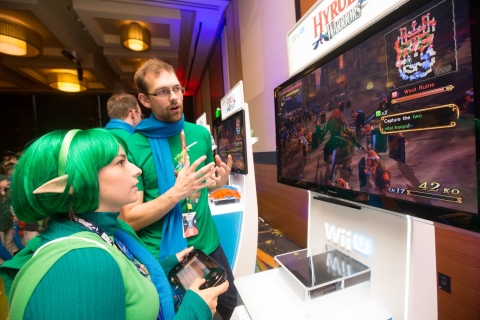 In this photo provided by Nintendo of America, Morgen Gage dressed as Saria, slashes through hundreds of enemies while playing Hyrule Warriors, during PAX Prime 2014 on Aug. 30, 2014 in Seattle. Hyrule Warriors launches for Wii U on Sept. 26. The gathering presented excited fans with the opportunity to preview the unreleased game. (Photo by STEPHEN BRASHEAR/Invision for Nintendo/AP Images)