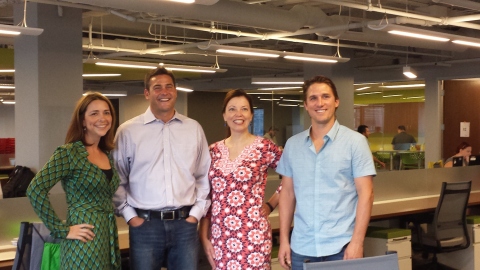 SIM Partners executives (from L to R) Tari Haro, Jon Schepke, Amy Cooper and Neil Mahoney at the company's new headquarters in Chicago. (Photo: Business Wire)