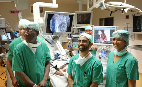 (Left to Right) The surgical team of Prof. Georges Lawson of The University Hospital Dinant Godinne-UCL Namur (Belgium), Dr. Umamaheswar Duvvuri of the University of Pittsburgh Medical Center (USA) and Dr. Magis Mandapathil of University Hospital of Marburg immediately following the use of the Flex(R) System, a first of its kind flexible robot system. (Photo: Business Wire)