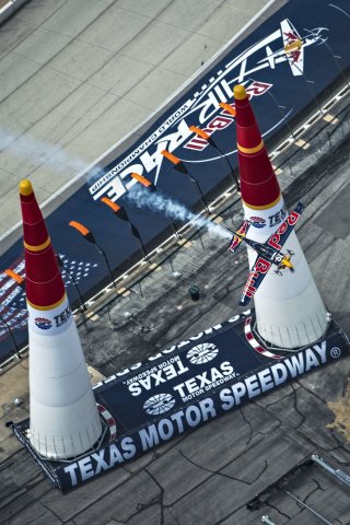 Kirby Chambliss of the United States performs during the finals for the sixth stage of the Red Bull Air Race World Championship at the Texas Motor Speedway in Fort Worth, Texas, United States on September 7, 2014. (Photo: Sebastian Marko/Red Bull Content Pool)