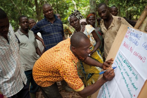 Ivory Coast cocoa farmers learning modern agricultural farming practices through Hershey’s Learn to Grow program. (Photo: Business Wire)