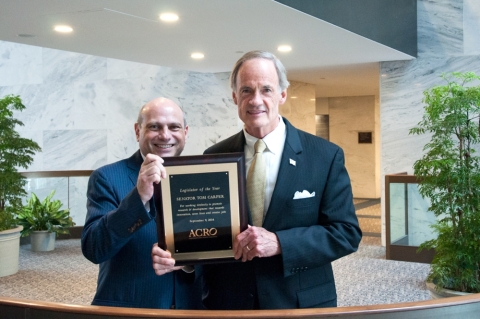 Senator Tom Carper (D-DE) receives ACRO's 2014 Legislator of the Year Award from ACRO Senior Vice President John Lewis. (Photo: Business Wire)