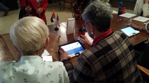 Precinct Election Workers using the EA Tablet System to check in voters. The System reduces provisional ballots and speeds the check in process at the polling place. (Photo: Business Wire)