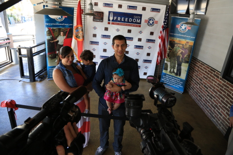 U.S. Marine Corporal Esteban Russi and his family. (Photo: Business Wire)