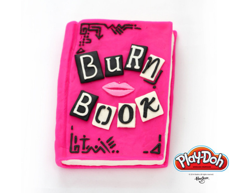 On National PLAY-DOH Day, we wear pink. The PLAY-DOH brand has sculpted The Plastics' infamous "Burn Book," containing all of the rumors and gossip from the halls of North Shore High, in celebration of National PLAY-DOH Day on September 16, 2014. Six "back-to-school" themed sculptures were made out of 100% PLAY-DOH compound and took over 40 hours to create. Be sure to stop by the PLAY-DOH Facebook page to check out the other five creations: https://www.facebook.com/playdoh (Photo: Business Wire)