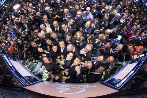 View of the trading crowd surrounding the Alibaba IPO on the NYSE. (Photo: Business Wire)