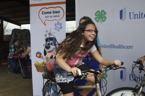 Chloe Yourgules (11) from Pategonia Middle School creates her own healthy smoothie using pedal power at the annual Santa Cruz County Fair in Sonoita, on Sept. 19. The specially made blender bikes donated to Arizona 4-H by UnitedHealthcare are part of a $40,000 grant announced today that will promote healthy living among youth (Photo by Tom Freeland for UnitedHealthcare)