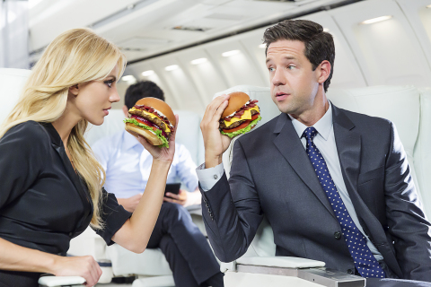 Model and actress Bar Paly ("Pain & Gain," "Million Dollar Arm") will star in a new national TV advertising campaign to promote the Mile High Bacon Cheese Thickburger that will begin airing next week. Titled "Propositioning," the spot is set aboard an airplane mid-flight, where Paly asks her on-set husband to join her in the Mile High Club. (Photo: CKE Restaurants/Fab Fernandez)