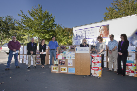 Pam Jamian (at podium), UnitedHealthcare's Chico site director, on Wednesday, Oct. 1, announces UnitedHealthcare employees have collected 4,000 pounds of food and everyday items for Catalyst Domestic Violence Services' emergency shelter to help highlight October's Domestic Violence Awareness Month as community leaders look on. Left to right: Mike Maloney, former Chico police chief; Chico Mayor Scott Grendl; Katie Simmons, president and CEO, Chico Chamber of Commerce; Chico City Councilmember Randall Stone; Butte County supervisors Maureen Kirk and Larry Wahl; and Anastacia Snyder, Catalyst executive director (Photo: Brian Peterson).