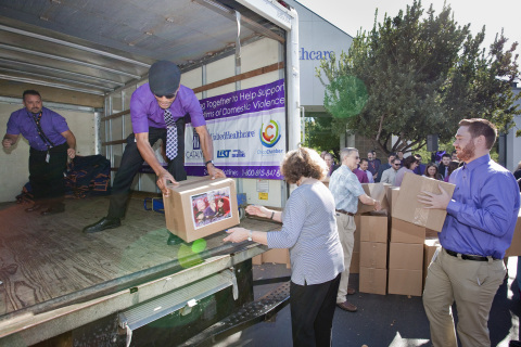 Butte County Supervisor Maureen Kirk (middle right) and UnitedHealthcare employees (left to right) Shannon Cloud, Matthew Turner and Chris Plymesser on Wednesday, Oct. 1, help load boxes of food and everyday items onto a truck to be delivered to Catalyst Domestic Violence Services emergency Shelter. UnitedHealthcare employees and Chico Chamber of Commerce helped highlight October's Domestic Violence Awareness month by delivering more than 4,000 pounds of food and dozens of boxes of everyday necessities such as toothbrushes, soap and blankets for Catalyst's emergency shelter (Photo: Brian Peterson).