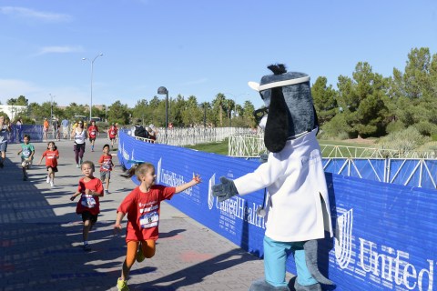 UnitedHealthcare mascot Dr. Health E. Hound is pictured at the finish line of the UnitedHealthcare IRONKIDS Las Vegas Fun Run at Henderson Pavilion. More than 200 youth participated in today's race for "triathletes to be." (Photo credit: Bryan Steffy)