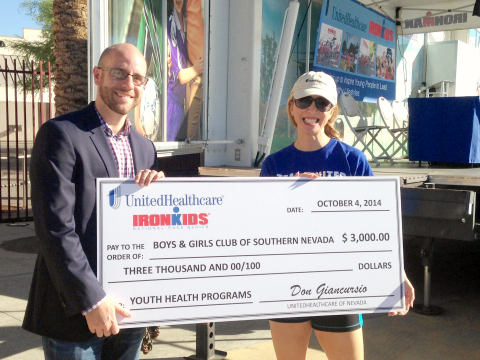 UnitedHealthcare of Nevada chief medical officer, Dr. Laurine Tibaldi, presents a $3,000 cheque to Brian Knudson, president, Boys & Girls Clubs of Southern Nevada, to support the Club's healthy living programs. (Photo credit: Bryan Steffy)