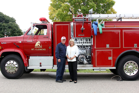 Axalta’s Ken Hohlbein and Attendee Denise Froehlich with Axalta manufacturing plant fire truck during Macomb County Business Preparedness Conference. (Photo: Business Wire) 



