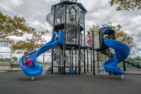 Students from Midland Beach, Staten Island enjoying their new playground and 25-foot lighthouse themed Miracle Mega Tower® (Photo: Business Wire)