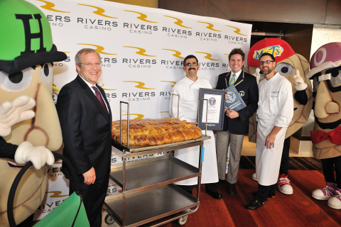 Pittsburgh's Rivers Casino has set a new GUINNESS WORLD RECORDS title for largest pierogi. The dumpling, filled with potatoes and cheddar cheese, weighed in at 123 pounds. Left to right: General Manager Craig Clark, Executive Chef Richard Marmion, Guinness World Records Adjudicator Michael Empric and Assistant Executive Chef Adam Tharpe. (Photo: Business Wire)