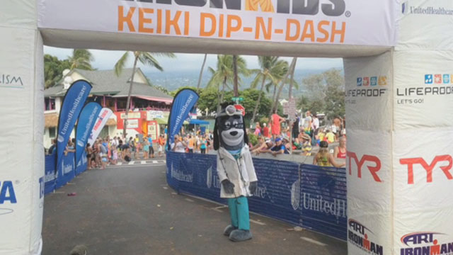 Young athletes, including nearly 100 from Kama'aina Kids are congratulated by UnitedHealthcare's mascot Dr. Health E. Hound as they cross the finish line and become IRONKIDS at the 2014 UnitedHealthcare IRONKIDS Keiki Dip-n-Dash. Video Source: Kevin Herglotz