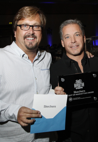 Shade Hotel owner Michael Zislis presents the 2014 Best of Manhattan award to SKECHERS president Mic ... 