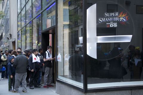 In this photo provided by Nintendo of America, Nintendo fans stop by Nintendo World in New York on Oct. 11, 2014, to honor the Super Smash Bros. franchise and watch 16 of the best players in the country show off their skills in the Super Smash Bros. for Nintendo 3DS National Open Tournament. The event was viewed by local fans and countless online spectators.