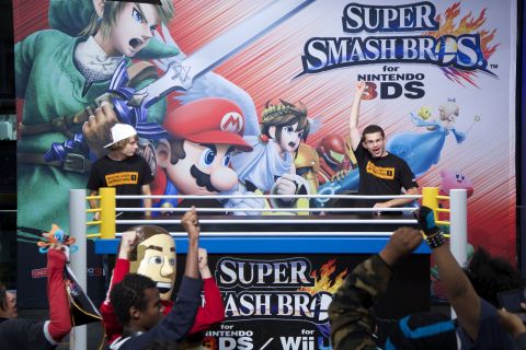 In this photo provided by Nintendo of America, contestant Samuel Buzby (R) of Nesconset, NY defeats Jesse McColm of Balch Springs, TX in the final match at the Super Smash Bros. for Nintendo 3DS National Open Tournament on Oct. 11, 2014, at Nintendo World in New York. Character customization played an important role in the tournament which was viewed by local fans and countless online spectators, allowing the top 16 players to engage in an all-out, no-holds-barred battle showcasing the game's unique features.