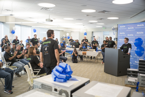 Tom Wolf, MetLife's senior vice president, Enterprise Applications Development, welcomes families and thanks volunteers. (Photo: Business Wire)