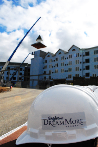 Crews complete the outside profile of Dollywood's DreamMore Resort during a topping out ceremony on Oct. 22, 2014. (Photo: Business Wire)