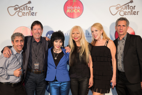 The Hot Topic Foundation gives $250,000 to Little Kids Rock at annual benefit honoring Joan Jett. L-R: Dave Wish, CEO of Little Kids Rock, Joe Emory, Hot Topic Foundation, Joan Jett, Daang Goodman of TRIPP NYC, Cindy Levitt, SVP at Hot Topic and Ray Goodman, TRIPP NYC. (Photo: Business Wire)