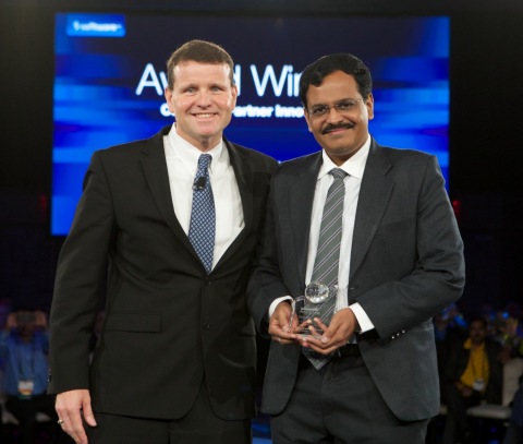 Harish Dwarkanhalli of Cognizant receives the Innovation Award for Partner Innovation from Software AG President and CEO, North America, Jay Johnson during Software AG's Innovation World 2014 in New Orleans. (Photo: Business Wire)