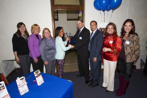 UnitedHealthcare's Laura Roberts, Lillian Cirasuolo and Annette Gates (from left to right) join New York State Sen. Joseph Griffo (third from right) and Utica Safe Schools' executives Carrie McMurray, Anne Lansing and Jeremy Butler, and Proctor High School junior Jada Wilson (from right to left) at a ribbon-cutting ceremony to open a computer lab at Utica Safe Schools' "Underground Cafe" teen center. UnitedHealthcare Community Plan of New York donated 12 computers to establish the computer lab as part of its national Community Computer effort. UnitedHealthcare has helped establish eight community computer labs this year in New York State with deliveries of more than 24 refurbished computers (Photo: Michael Okoniewski).