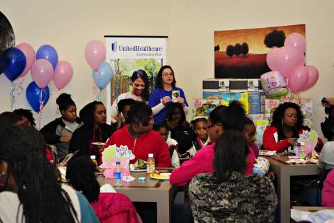 Bobbye Smith of UnitedHealthcare talks to new and expectant mothers during a community baby shower hosted by the company in Meridian, Miss. More than 60 women attended the event, receiving important prenatal and well-baby care resources and information. Attendees received gift bags and door prizes, and learned about innovative programs such as Baby Blocks, which helps manage doctor visits and other baby care during pregnancy and the first two years of their baby's life (Photo: Rachelle Hopkins).