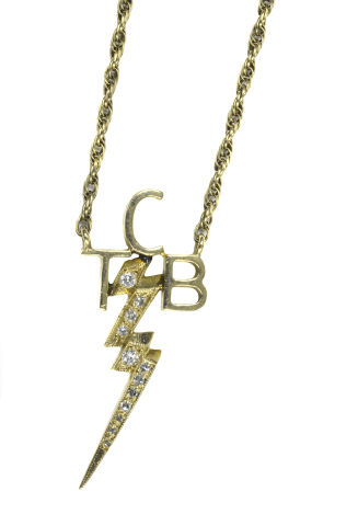 TCB 14 Karat Gold & Diamond Necklace gifted by Elvis to Tommy Henley. Elvis was known to give the TCB (Taking Care of Business) to those men close to him and TLC (Tender Loving Care) to the women who were close friends. The necklace has 12 inset diamonds contained in the lightning bolt pendant with 14 karat gold rope chain design. (Photo: Business Wire)