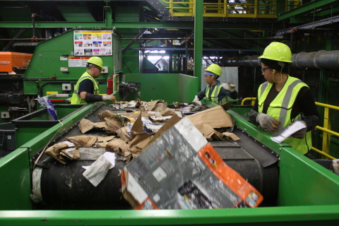 Conveyor belt at a single-stream recycling facility, where recyclables are separated by both machines and workers. (Photo: Business Wire)