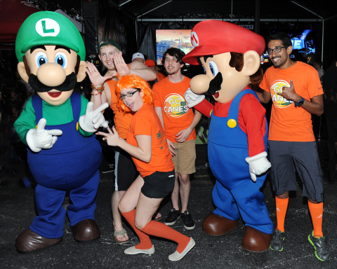 In this photo provided by Nintendo of America, excited football fans gather outside Sun Life Stadium before the Florida State University vs. University of Miami game on Nov. 15, 2014, for the chance to play the Super Smash Bros. for Nintendo 3DS and Super Smash Bros. for Wii U game. Nintendo of America is bringing these all-star brawling games to college campuses across the country this fall as a part of the College Tailgate Tour.