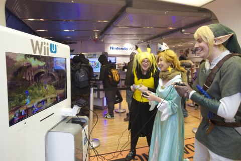 In this photo provided by Nintendo of America, Elle M. (left) from Flushing, NY, Julia D., from Brooklyn, NY, and Erich M., from Brooklyn, NY, play the Super Smash Bros. for Wii U video game at the Nintendo World store launch event in New York on Nov. 20, 2014.