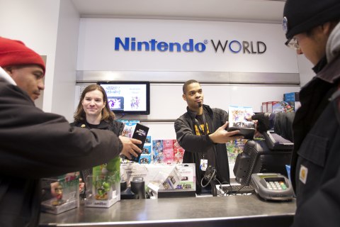 In this photo provided by Nintendo of America, Jose G. of Brooklyn, NY, (left) and Marcus L., of Bronx, NY, are among the first consumers to purchase amiibo figures and Super Smash Bros. for Wii U at the launch celebration at Nintendo World in New York on Nov. 20, 2014. Both launched in the U.S. on Nov. 21, 2014.