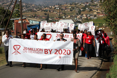 Representatives from the AIDS Healthcare Foundation (AHF) and the KwaZulu-Natal Department of Health march with local residents in Durban, South to celebrate the groundbreaking of the first AHF clinic in South Africa to be built from the ground up in Umlazi. For World AIDS Day, AHF will host over 160 events around the world to promote testing, treatment for HIV AIDS. Holding banner: (2nd from right): Michael Weinstein, AIDS Healthcare Foundation President; (Far right): Penninah Iutung Amor, MD, AHF Africa Bureau Chief. (Photo: Business Wire)