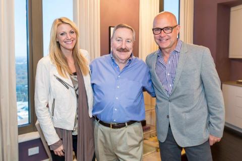 Interior designer Lindsay Pumpa and home planner Jack Thomasson (far right), give winner Dan Cavanaugh his first look around the HGTV Urban Oasis 2014 at The Residences at Mandarin Oriental, Atlanta. (Photo: Business Wire)