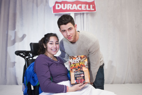 Nick Jonas and SickKids patient ambassador, Aziza, launch the Duracell "Powering Holiday Smiles" program. For every pack of Duracell Quantum or CopperTop batteries purchased at Walmart Canada from December 1st to December 31st 2014, Duracell will donate 20 cents to Children's Miracle Network, with the goal to raise $150,000. (Photo: Business Wire)