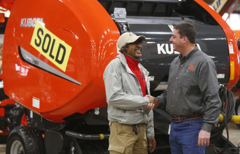 Customer Frank Westbrook (left) shakes hands with Kubota Dealer John Scott of Kubota Center West Tulsa as he proudly takes ownership of his new BV4180 Hay Baler. (Photo: Business Wire)